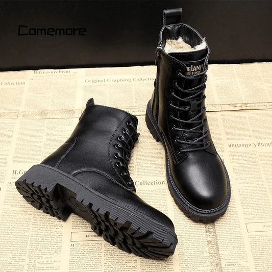 Black leather boots on a newspaper background