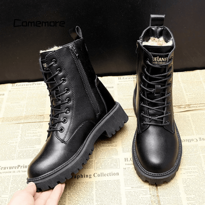 Black leather boots with fur lining on a newspaper background