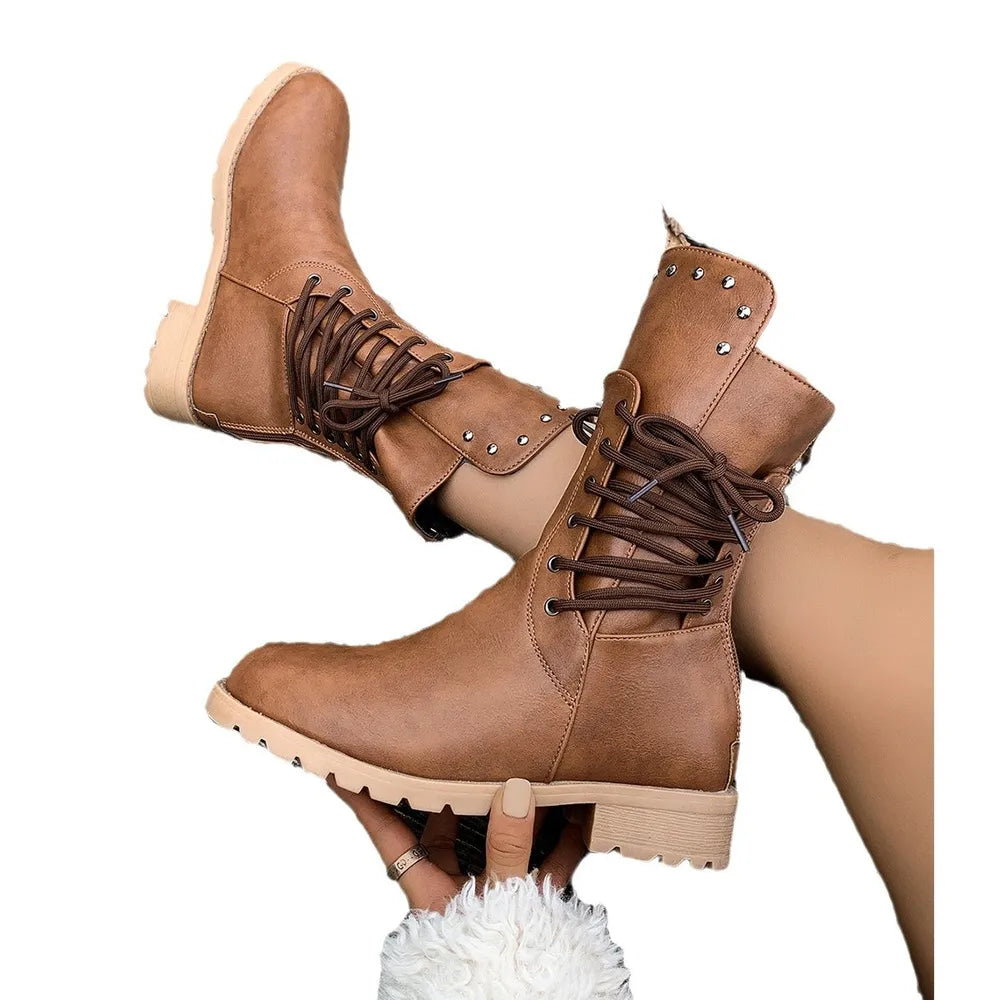 Brown vegan leather boots with studded details on a white background