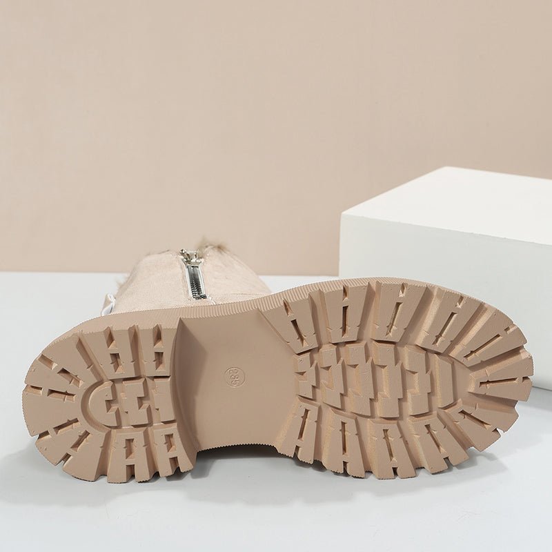 Close-up of a beige boot sole on a light background